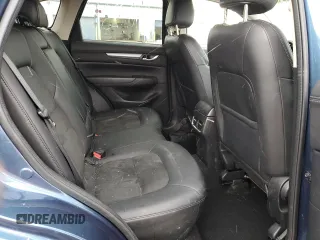 2017 Mazda CX-5 Touring z VIN JM3KFBCL2H0129000, wystawiony jako Copart lot #52107005 z przebiegiem 55 411 mil mil oraz Szkody całkowita. Historia ofert i sprzedaży dostępna na DreamBid. Obrazek 11.