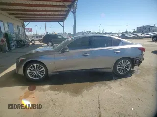 2019 Infiniti Q50 Luxe z VIN JN1EV7AP4KM514928, wystawiony jako Copart lot #56694755 z przebiegiem 63 705 mil mil oraz Szkoda całkowita • Salvage title. Historia ofert i sprzedaży dostępna na DreamBid. Obrazek 14.