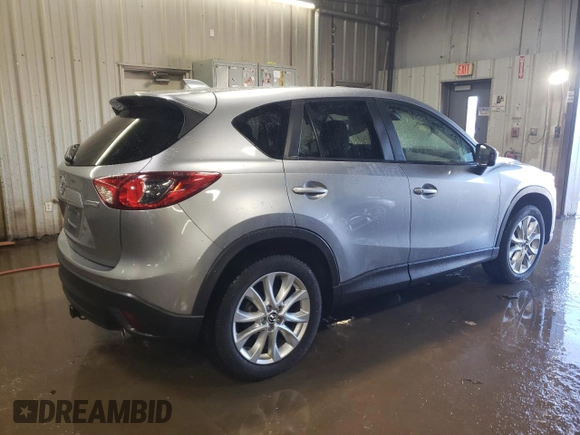 2015 Mazda CX-5 Grand Touring with VIN JM3KE4DY5F0456142, listed as a Copart auction lot 49353845 with 193,512 mi miles and Salvage Title. Bid and sale history available at carsss.com. Image 3.