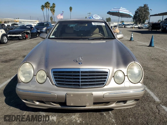 2000 Mercedes-Benz E-Class AWD with VIN WDBJF82G0YX029026, listed as a Copart auction lot 78106604 with 134,482 mi miles and Salvage Title. Bid and sale history available at carsss.com. Image 5.