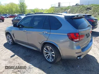 2014 BMW X5 xDrive50i with VIN 5UXKR6C57E0J72301, listed as a IAAI auction lot 39379887 with 117,012 mi miles. Bid and sale history available at carsss.com. Image 3.
