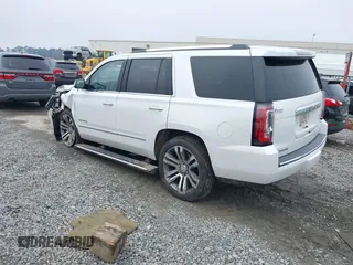 2019 GMC Yukon Denali with VIN 1GKS1CKJ7KR364240, listed as a IAAI auction lot 41645374 with 104,956 mi miles. Bid and sale history available at carsss.com. Image 3.