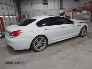 2014 BMW 6 Series 650i xDrive z VIN WBA6B4C55ED371378, wystawiony jako IAAI lot #41640888 z przebiegiem 80 927 mil mil oraz . Historia ofert i sprzedaży dostępna na DreamBid. Obrazek 4.
