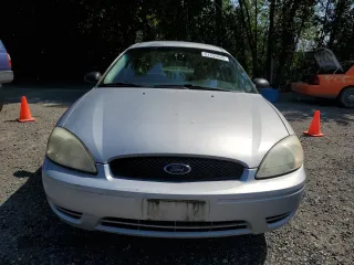 2005 Ford Taurus SE с VIN 1FAFP53U05A259841, выставлен на аукционе Copart как лот 57255835 с пробегом 179 821 миль миль и Списание • Salvage title. История ставок и продаж доступна на DreamBid. Изображение 5.