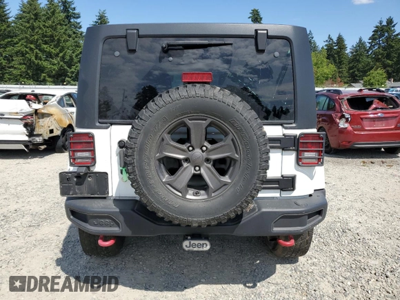 2014 Jeep Wrangler Unlimited Sahara z VIN 1C4BJWEG8EL188271, wystawiony jako Copart lot #59972535 z przebiegiem 130 314 mil mil oraz Szkoda całkowita • Salvage title. Historia ofert i sprzedaży dostępna na DreamBid. Obrazek 6.