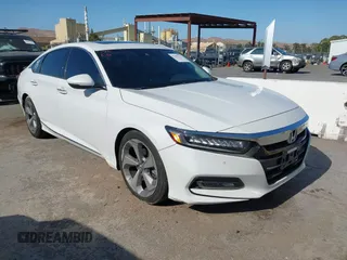 2018 Honda Accord Touring with VIN 1HGCV1F94JA107639, listed as a IAAI auction lot 42482273 with 92,594 mi miles and . Bid and sale history available at DreamBid. Image 1.