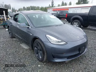 2018 Tesla Model 3 Long Range Battery z VIN 5YJ3E1EBXJF113942, wystawiony jako IAAI lot #42370424 z przebiegiem 40 888 mil mil oraz . Historia ofert i sprzedaży dostępna na DreamBid. Obrazek 1.