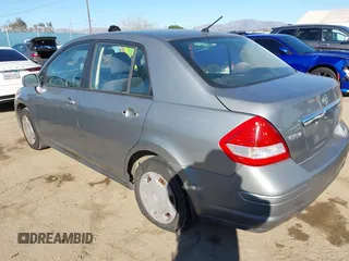 2009 Nissan Versa 1.8 S with VIN 3N1BC11E29L398542, listed as a IAAI auction lot 41689382 with 96,964 mi miles. Bid and sale history available at carsss.com. Image 3.