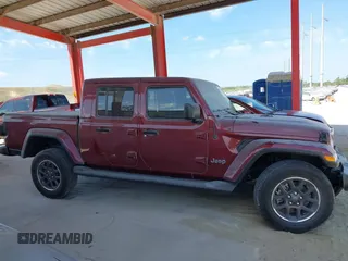 2021 Jeep Gladiator Overland z VIN 1C6HJTFGXML553983, wystawiony jako IAAI lot #41903068 z przebiegiem 54 386 mil mil oraz . Historia ofert i sprzedaży dostępna na DreamBid. Obrazek 13.