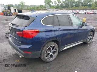 2018 BMW X1 xDrive28i with VIN WBXHT3C32J5L33213, listed as a IAAI auction lot 42513235 with 75,918 mi miles and . Bid and sale history available at DreamBid. Image 4.