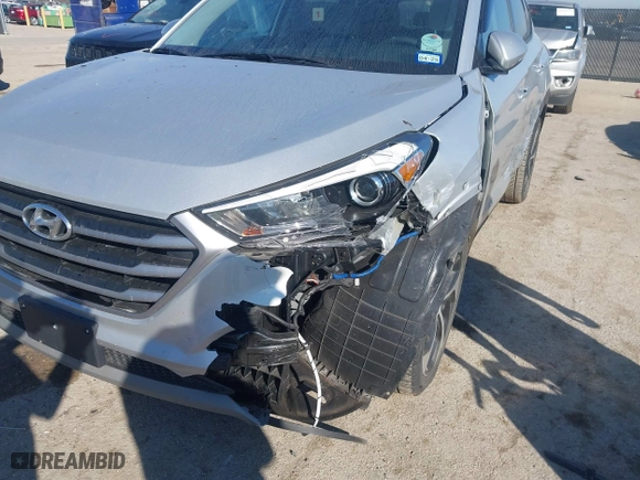 2017 Hyundai Tucson Value with VIN KM8J33A22HU457809, listed as a IAAI auction lot 41632652 with 26,154 mi miles. Bid and sale history available at carsss.com. Image 6.