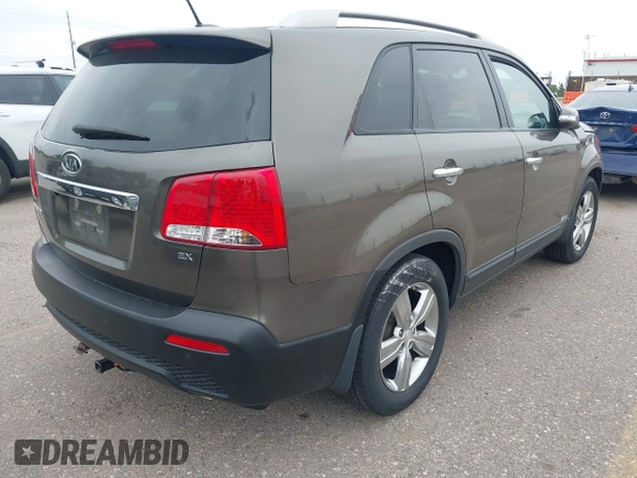 2012 Kia Sorento EX with VIN 5XYKUCA6XCG294104, listed as a IAAI auction lot 42413363 with 57,527 mi miles and . Bid and sale history available at DreamBid. Image 4.