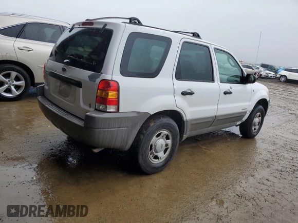 2001 Ford Escape XLS with VIN 1FMYU01191KA29996, listed as a Copart auction lot 86362534 with 265,271 mi miles and Salvage title. Bid and sale history available at DreamBid. Image 3.