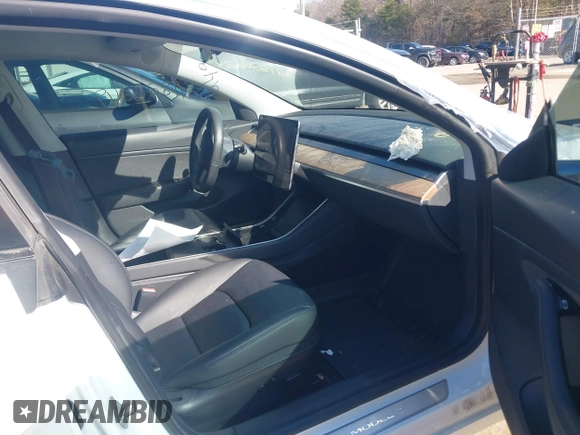 2020 Tesla Model 3 Long Range with VIN 5YJ3E1EBXLF636963, listed as a IAAI auction lot 41826249 with 68,085 mi miles. Bid and sale history available at carsss.com. Image 5.