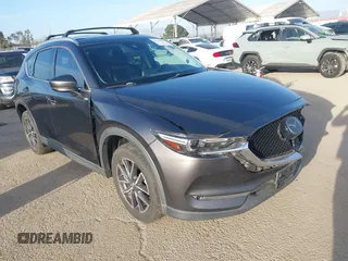 2018 Mazda CX-5 Grand Touring with VIN JM3KFBDM0J0405574, listed as a IAAI auction lot 41725319 with 44,380 mi miles. Bid and sale history available at carsss.com. Image 1.