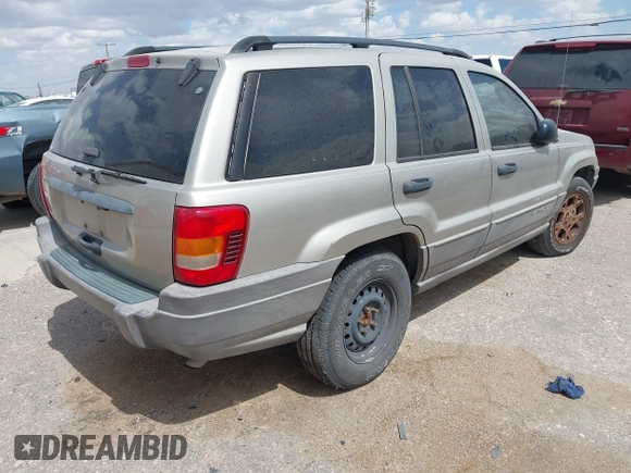 2003 Jeep Grand Cherokee Laredo with VIN 1J4GX48S73C515727, listed as a IAAI auction lot 42555080 with 275,035 mi miles and . Bid and sale history available at DreamBid. Image 4.