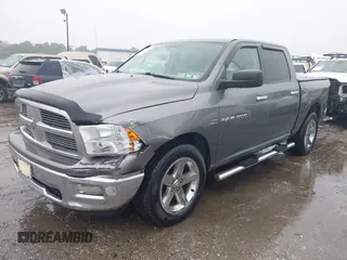 2012 Ram 1500 Outdoorsman z VIN 1C6RD7LT2CS215129, wystawiony jako IAAI lot #42278106 z przebiegiem 106 825 mil mil oraz . Historia ofert i sprzedaży dostępna na DreamBid. Obrazek 2.