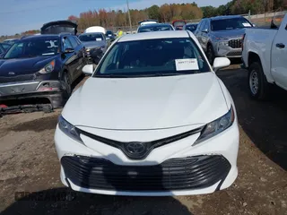 2020 Toyota Camry LE with VIN 4T1C11AKXLU986310, listed as a IAAI auction lot 40977100 with 108,208 mi miles and . Bid and sale history available at DreamBid. Image 12.