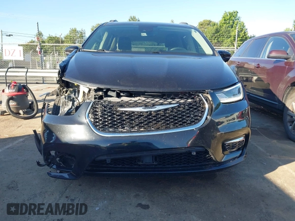 2022 Chrysler Pacifica Touring L with VIN 2C4RC1BG9NR117538, listed as a IAAI auction lot 42318518 with 103,311 mi miles and . Bid and sale history available at DreamBid. Image 13.