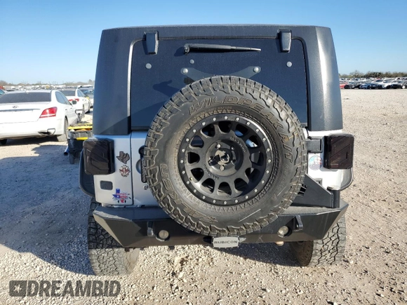 2009 Jeep Wrangler Rubicon with VIN 1J8GA64159L700909, listed as a Copart auction lot 86308954 with 138,065 mi miles and Salvage title. Bid and sale history available at DreamBid. Image 6.