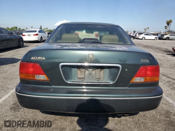 1996 Acura RL with VIN JH4KA965XTC009917, listed as a Copart auction lot 65083665 with 197,486 mi miles and Salvage title. Bid and sale history available at DreamBid. Image 6.