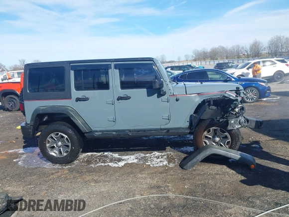 2015 Jeep Wrangler Unlimited Willys Wheeler with VIN 1C4BJWDG4FL589822, listed as a IAAI auction lot 41732614 with 149,112 mi miles and . Bid and sale history available at DreamBid. Image 14.