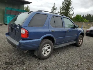 2002 Isuzu Rodeo S with VIN 4S2CK58W124301647, listed as a Copart auction lot 56973895 with 129,009 mi miles and Salvage title. Bid and sale history available at DreamBid. Image 3.