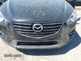 2016 Mazda CX-5 Grand Touring with VIN JM3KE4DY9G0893174, listed as a IAAI auction lot 41887814 with 79,811 mi miles. Bid and sale history available at carsss.com. Image 6.