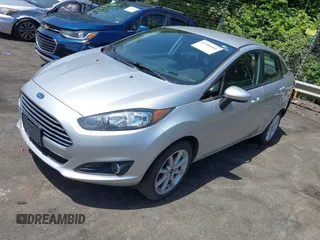 2019 Ford Fiesta SE z VIN 3FADP4BJ0KM133096, wystawiony jako IAAI lot #42204601 z przebiegiem 108 904 mil mil oraz . Historia ofert i sprzedaży dostępna na DreamBid. Obrazek 2.