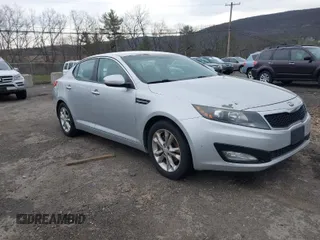 2013 Kia Optima LX with VIN 5XXGM4A74DG129353, listed as a IAAI auction lot 42035909 with 140,315 mi miles. Bid and sale history available at carsss.com. Image 1.