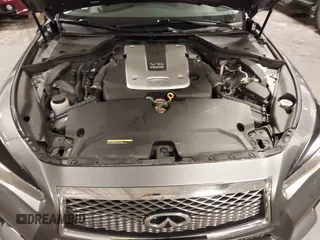 2014 Infiniti Q50 Premium with VIN JN1BV7ARXEM699902, listed as a IAAI auction lot 42135410 with 103,929 mi miles and . Bid and sale history available at DreamBid. Image 10.
