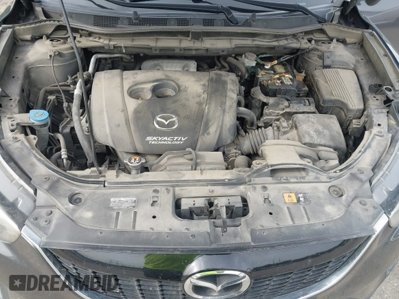 2014 Mazda CX-5 Touring z VIN JM3KE4CY2E0348500, wystawiony jako IAAI lot #42318155 z przebiegiem 182 616 mil mil oraz . Historia ofert i sprzedaży dostępna na DreamBid. Obrazek 10.