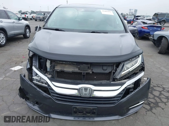 2018 Honda Odyssey Touring with VIN 5FNRL6H88JB062213, listed as a IAAI auction lot 42489379 with 90,578 mi miles and . Bid and sale history available at DreamBid. Image 13.