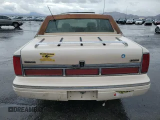 1995 Lincoln Town Car Cartier z VIN 1LNLM83W2SY603452, wystawiony jako Copart lot #55756595 z przebiegiem 243 394 mil mil oraz Szkody całkowita. Historia ofert i sprzedaży dostępna na DreamBid. Obrazek 6.