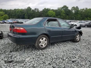 2000 Honda Accord EX z VIN 1HGCG1659YA073599, wystawiony jako Copart lot #58899565 z przebiegiem 389 828 mil mil oraz Szkoda całkowita • Salvage title. Historia ofert i sprzedaży dostępna na DreamBid. Obrazek 3.
