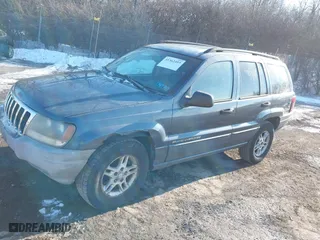 2002 Jeep Grand Cherokee Laredo with VIN 1J4GW48NX2C243282, listed as a IAAI auction lot 41362493 with 201,932 mi miles. Bid and sale history available at carsss.com. Image 2.