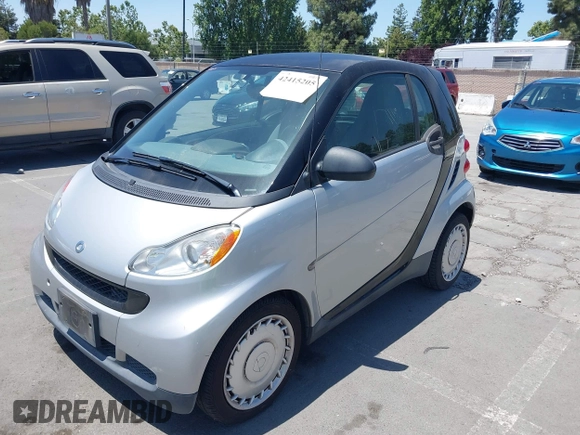 2009 Smart fortwo Pure z VIN WMEEJ31X59K325939, wystawiony jako IAAI lot #42415205 z przebiegiem 89 968 mil mil oraz . Historia ofert i sprzedaży dostępna na DreamBid. Obrazek 6.