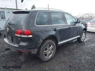 2009 Volkswagen Touareg 2 VR6 with VIN WVGBE77L29D010730, listed as a IAAI auction lot 41109415 with 230,325 mi miles. Bid and sale history available at carsss.com. Image 4.