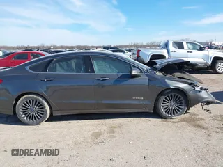 2017 Ford Fusion Hybrid Titanium z VIN 3FA6P0RU0HR314681, wystawiony jako IAAI lot #41288256 z przebiegiem 174 027 mil mil oraz . Historia ofert i sprzedaży dostępna na DreamBid. Obrazek 13.