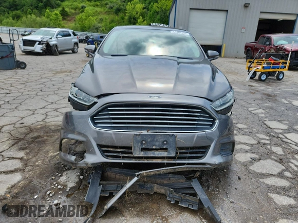 2013 Ford Fusion SE Hybrid with VIN 3FA6P0LU2DR329816, listed as a Copart auction lot 64308255 with 217,157 mi miles and Salvage title. Bid and sale history available at DreamBid. Image 5.