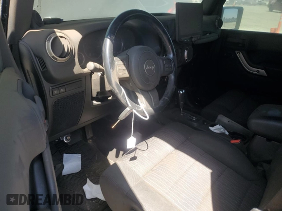 2012 Jeep Wrangler Unlimited Call of Duty MW3 with VIN 1C4BJWFGXCL148883, listed as a Copart auction lot 53162705 with 111,900 mi miles and Salvage title. Bid and sale history available at DreamBid. Image 8.