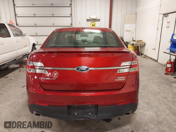 2014 Ford Taurus SEL z VIN 1FAHP2E83EG137639, wystawiony jako IAAI lot #41535259 z przebiegiem 62 978 mil mil oraz . Historia ofert i sprzedaży dostępna na DreamBid. Obrazek 16.