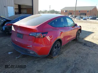 2023 Tesla Model Y Long Range with VIN 7SAYGDEE8PF709459, listed as a IAAI auction lot 41334108 with 51,544 mi miles. Bid and sale history available at carsss.com. Image 4.