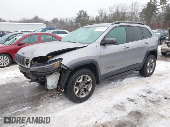 2019 Jeep Cherokee Trailhawk z VIN 1C4PJMBX2KD298169, wystawiony jako IAAI lot #41412123 z przebiegiem 63 214 mil mil oraz . Historia ofert i sprzedaży dostępna na DreamBid. Obrazek 2.
