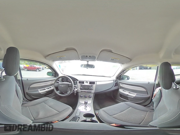 2010 Chrysler Sebring Touring z VIN 1C3CC4FB3AN203543, wystawiony jako Copart lot #57767985 z przebiegiem 152 951 mil mil oraz Szkoda całkowita • Salvage title. Historia ofert i sprzedaży dostępna na DreamBid. Obrazek 14.