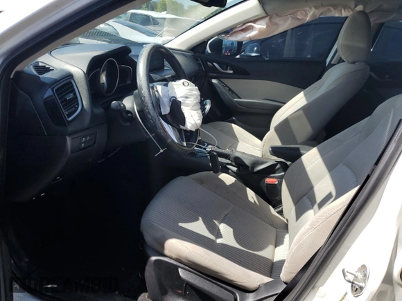 2016 Mazda 3 i Touring z VIN JM1BM1W70G1299548, wystawiony jako Copart lot #52575085 z przebiegiem 136 964 mil mil oraz Szkoda całkowita • Salvage title. Historia ofert i sprzedaży dostępna na DreamBid. Obrazek 7.