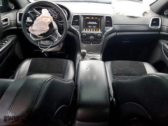 2018 Jeep Grand Cherokee Altitude with VIN 1C4RJFAGXJC122688, listed as a Copart auction lot 61290525 with 106,671 mi miles and Salvage title. Bid and sale history available at DreamBid. Image 8.