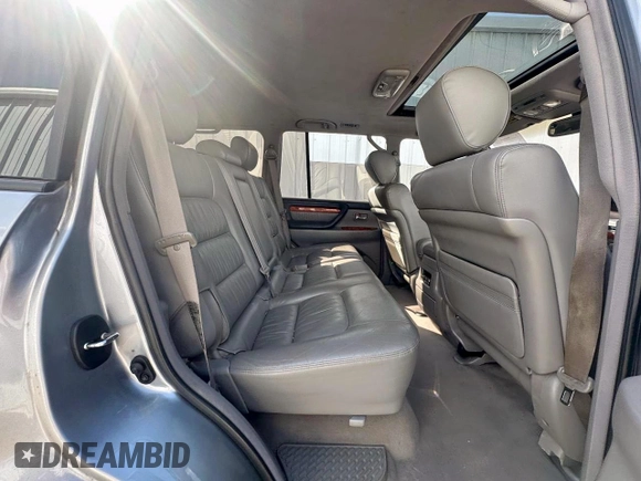 2003 Lexus LX 470 z VIN JTJHT00W933535214, wystawiony jako Copart lot #62037495 z przebiegiem 373 210 mil mil oraz Czysty tytuł • Clean title. Historia ofert i sprzedaży dostępna na DreamBid. Obrazek 6.