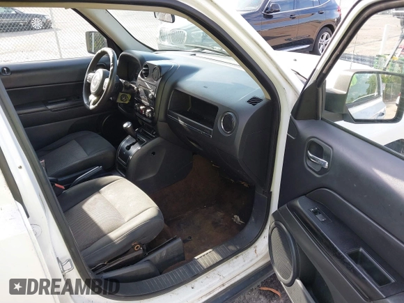 2014 Jeep Patriot Sport with VIN 1C4NJPBBXED671220, listed as a IAAI auction lot 42163245 with 216,848 mi miles. Bid and sale history available at carsss.com. Image 5.