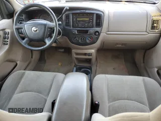 2001 Mazda Tribute LX with VIN 4F2CU08111KM19933, listed as a Copart auction lot 81174614 with 209,736 mi miles and Salvage Title. Bid and sale history available at DreamBid. Image 8.